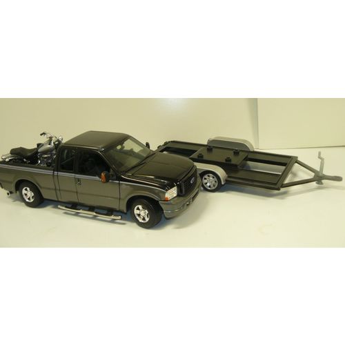 1/18 black and silver, Harly Davidson truck with a motorcycle, pulling a car tra