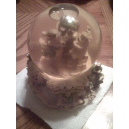 Water globe plays music Winter scene