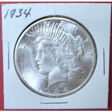 1934 Peace Dollar. This Coin is a replica and contains NO precious metal.