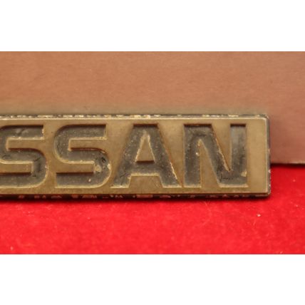 1980’s “Nissan” 3.75” Plastic Rear Trunk Lid Emblem OEM