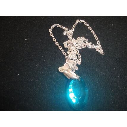 Stunning electric blue faceted oval pendant on snake chain necklace