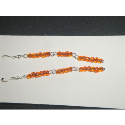 Beautiful dark orange long drop slim earrings work play anywhere