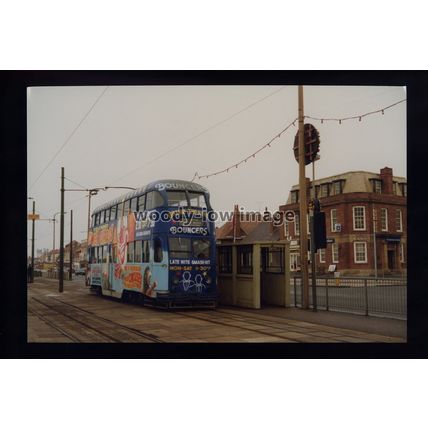 tm8271 - Blackpool Tram - Multi Advert Livery Tram to Manchester. photograph 6x4