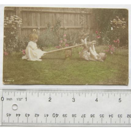 1913 postcard Children on SeeSaw