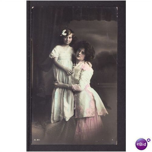TWO GIRLS SHOWING DRESS FASHION STUDIO COLOUR PHOTO POST CARD USED