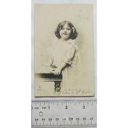 1905 postcard - Girl Standing Beside Chair