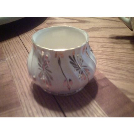 Sugar bowl made in England cream color with gold accents