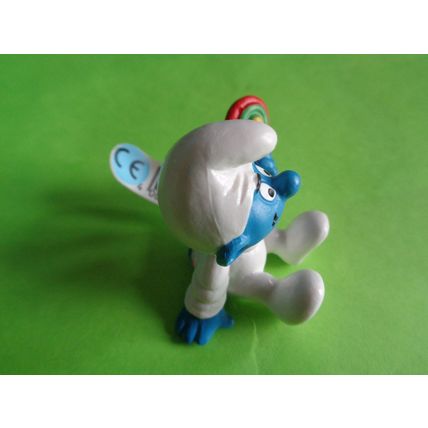 Baby smurf sitting up with rattle and label 2004