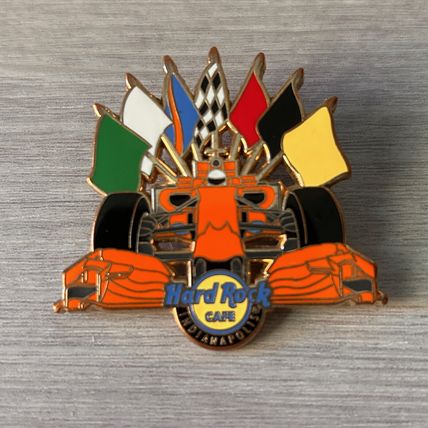 HARD ROCK CAFE INDIANAPOLIS ORANGE RACING CAR SEVEN RACING FLAGS PIN
