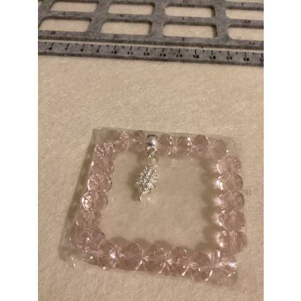 Light pink glass bead bracelet with hedgehog charm