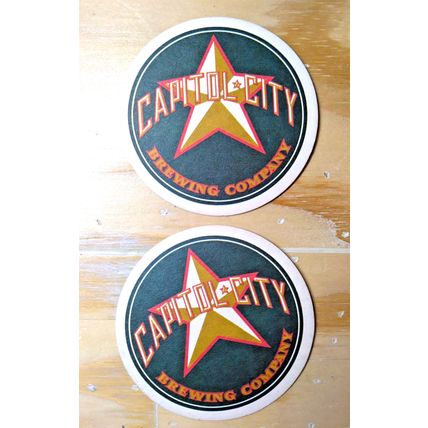 (2) Amber Waves "Full Bodied" Ale/ Capitol City Brewing Co. Coasters 3 1/2" dia.