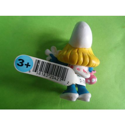 Smurfette smurf holding a flower and bag With a label