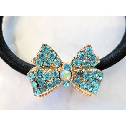 Small bow shaped hair tie pony tail holder with crystals