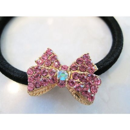 Small bow shaped hair tie pony tail holder with crystals