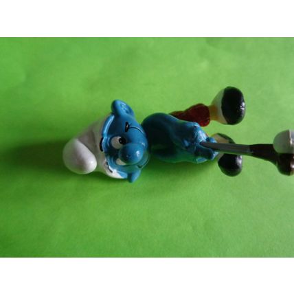 Golfer smurf complete with his golf club red trousers