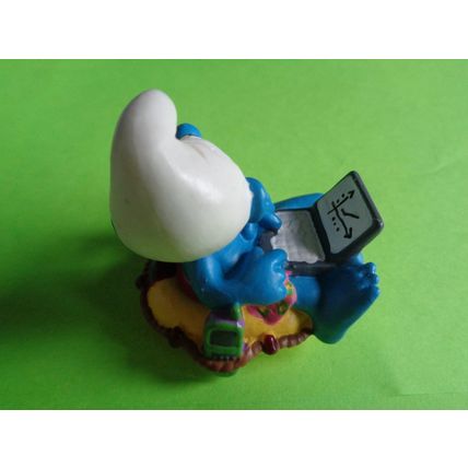 Workaholic smurf with laptop rubber ring and drink