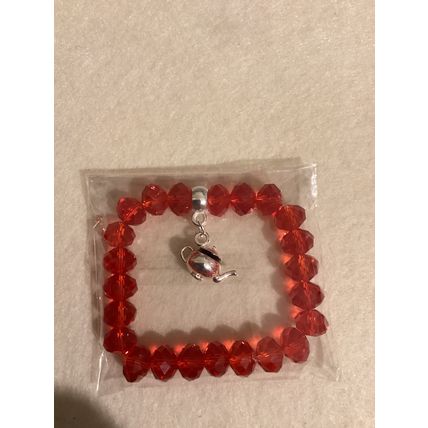 Red glass bead bracelet with teapot charm