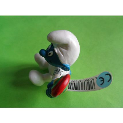 Baby smurf sitting up with rattle and label 2004