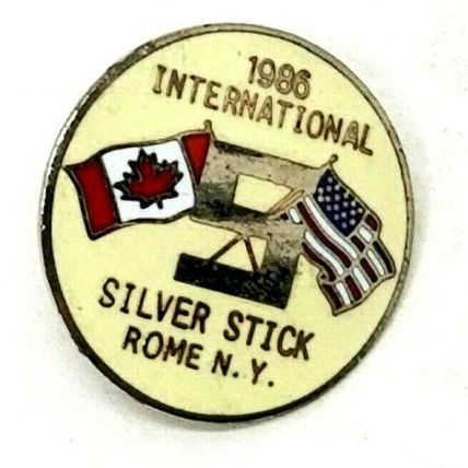 International 1987 Silver Stick Rome N.Y. Hat Pin Pinback (B58)