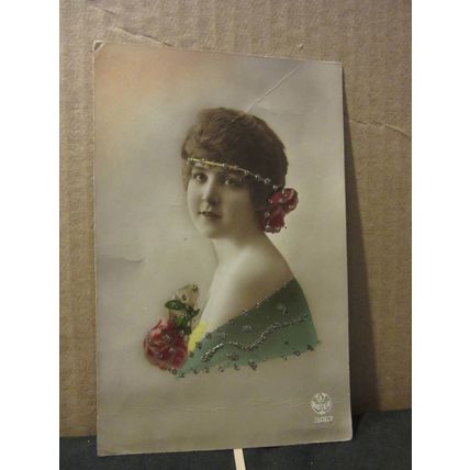 A PRETTY YOUNG GIRL WITH ROSES . used postcard 1923 Belgian pm =