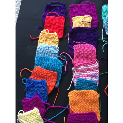 50 knitted squares in Various Colours Sizes.