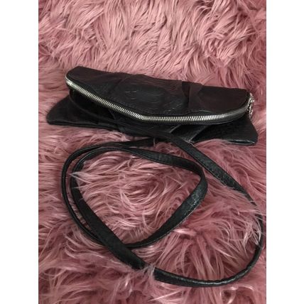 Kate Hill crossbody women's black handbag. Can be folded