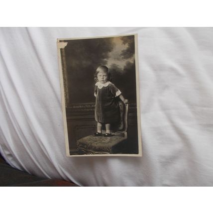 GIRL STANDING ON CHAIR (23/01) POST O.SEAS
