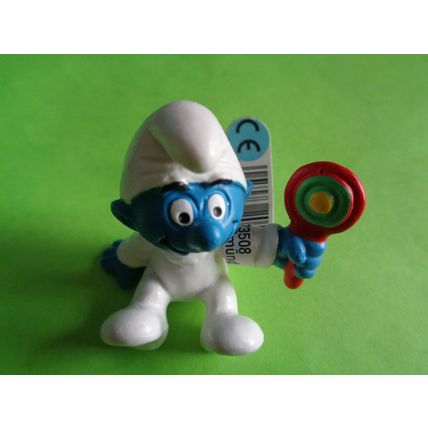 Baby smurf sitting up with rattle and label 2004