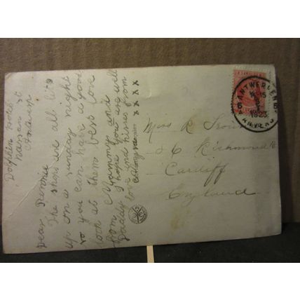 A PRETTY YOUNG GIRL WITH ROSES . used postcard 1923 Belgian pm =