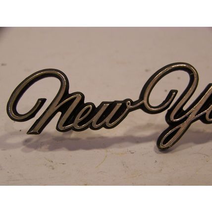1976 77 78 CHRYSLER NEW YORKER GOLD SCRIPT EMBLEM #3569955 W/ STUDS 71 72 73 74