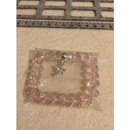 Light pink glass bead bracelet with dragonfly charm