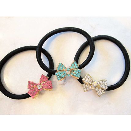 Small bow shaped hair tie pony tail holder with crystals