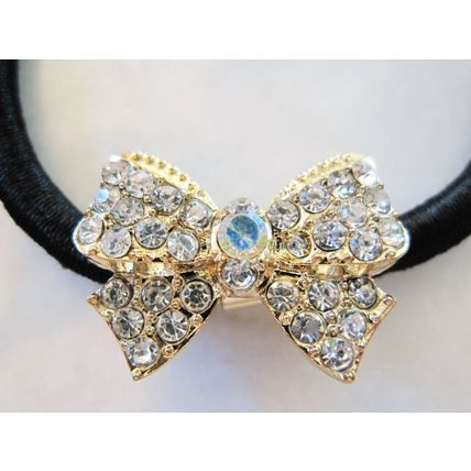 Small bow shaped hair tie pony tail holder with crystals