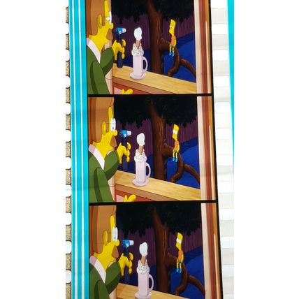 Simpsons Movie. Pk FE FE - 041O. 1 STRIP OF 5 - 35MM FILM CELLS