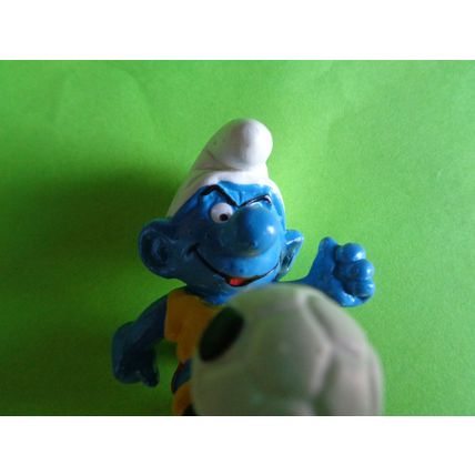 Footballer smurf complete with foot ball