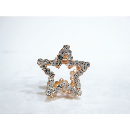 Small mini rose gold star shaped hair claw clip with crystals