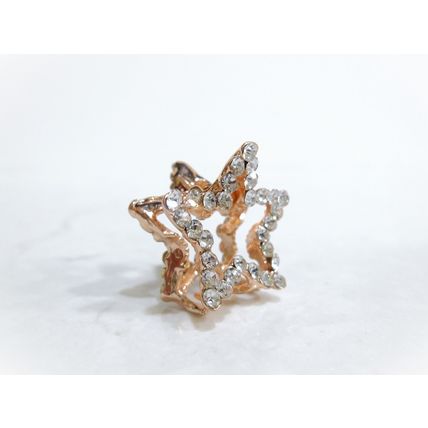 Small mini rose gold star shaped hair claw clip with crystals