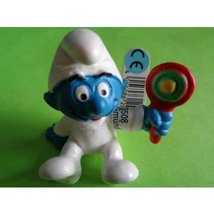 Baby smurf sitting up with rattle and label 2004