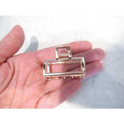 Small rose gold or silver tone metal hair claw clip
