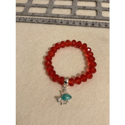 Red glass rondelle elastic bracelet with silver plated charm