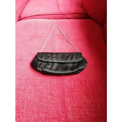 Black vintage satin clutch bag with a metal strap