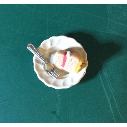 Slice of Cake on a White China Plate