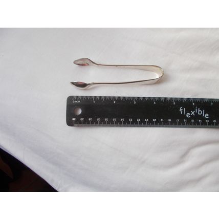 TONGS/ G G B ? WHITE METAL (08/01)