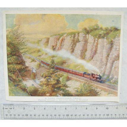 Vintage print - A long passenger train passing through a beautiful valley