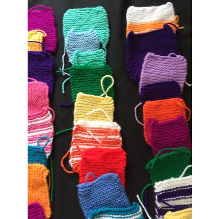 50 knitted squares in Various Colours Sizes.