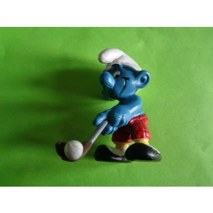 Golfer smurf complete with his golf club red trousers