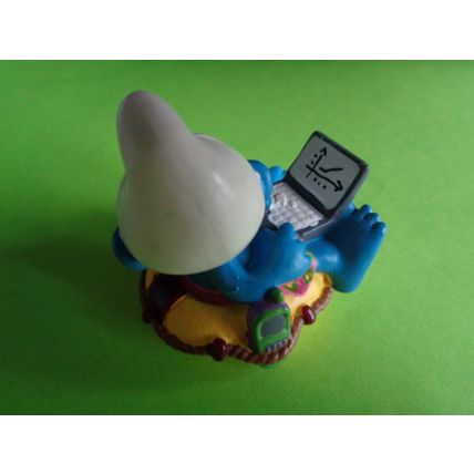Workaholic smurf with laptop rubber ring and drink