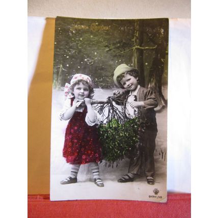 HAPPY CHRISTMAS used vintage postcard RP children with mistletoe