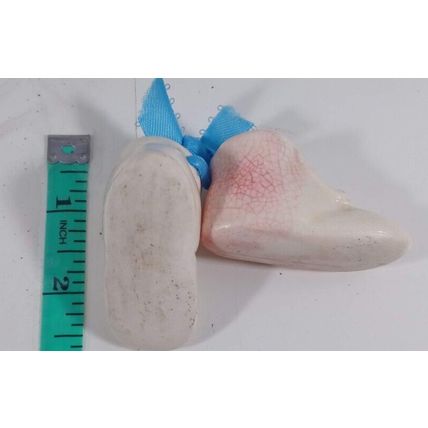 pair of old fashion baby booties minature glass blue ribbon