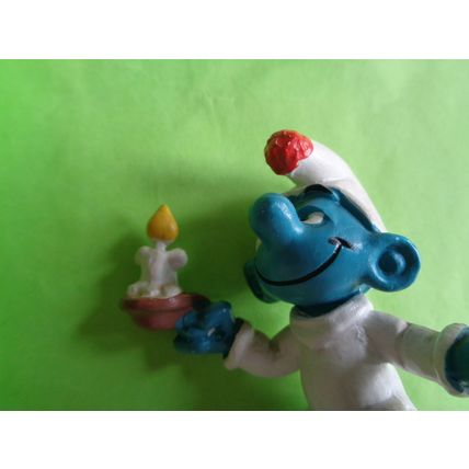 Smurf with a candle